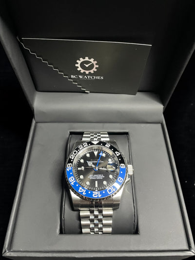 Wristwatch with blue accents in a branded box