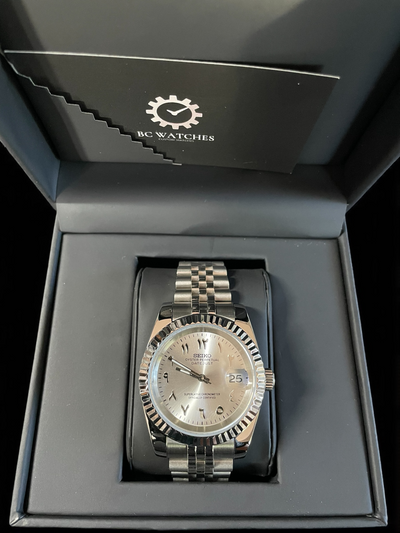 Silver watch in a black box with BC Watches logo