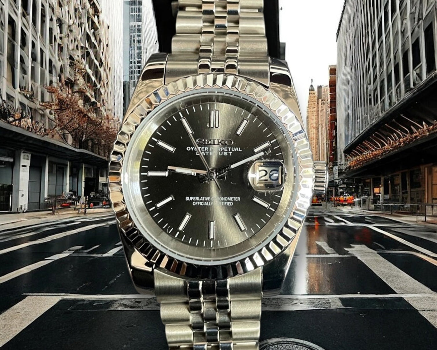 Silver Omega watch with a black face on a city street background